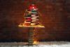 A Christmas tree structure made from a pile of books