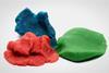 Three blue, red and green lumps of plasticine