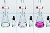 A sequence of three photos showing a titration experiment