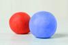 A red and a blue balls of plasticine