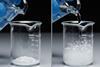 A series of photos showing a latex gloved hand pouring a colourless liquid onto a white powder, leading to a vigorous reaction of bubbles