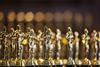 An image showing golden statues representing academy awards