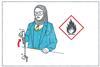 A girl in school uniform with a headscarf heats a testube of liquid over a bunsen burner