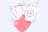 A hand holding playing cards showing ions