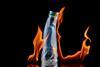 A plastic bottle with fire