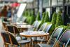 A row of outside cafe tables