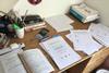 An image of the desk of Olympiad 2020 finalist Rtvik Patel with his preparation materials
