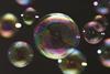 A close-up image of soap bubbles illustrating the multicoloured rainbow effect that is visible on their surface