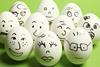 10 eggshells with faces drawn on them
