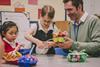 Teacher with two primary pupils working on a STEM project