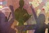 An artwork using flat colours and icons of a teacher in from of a class of school students. The students have their hands raised and pasted over the image is a map, connections, a book and some symbols.