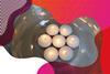 Photo of seven lit tea lights in a glass bowl