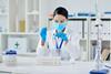 Woman in a lab conducting a research experiment
