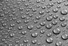 picture of drops of water on a teflon surface