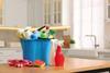Household cleaning supplies in a modern kitchen