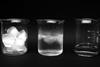 picture of 3 beakers showing, ice cubes, partly melted ice cubes and water