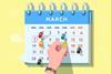 A hand sticks a pin in a date on a calendar