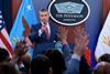 U.S. Secretary of War Pete Hegseth calls on reporters who have their hands raised with questions during a press briefing at the Pentagon