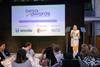 A woman at a podium on stage at the BESA Awards 2025
