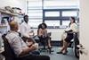 Teachers having a staff meeting. They are having a positive discussion.