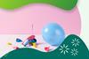 An inflated balloon next to burst balloons