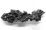 A piece of black glass in an odd shape
