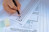A student answering a multiple choice chemistry questions with a pencil
