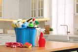 Household cleaning supplies in a modern kitchen
