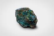 A macro photograph of a piece of rock with malachite (copper ore)