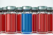 several ampules containing a red solution and one containing a blue solution