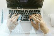 hands on a laptop with an overlay of chemical symbols