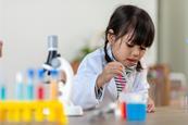 girl with pipette and beaker