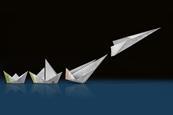 A 3d illustration of some origami made from structure strips. The origami develops from a simple boat through other more complex boats to a sleek paper airplane which is taking off.