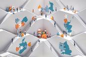 People on different levels connected by stairs with giant jigsaw pieces and maps of Ireland, England, Scotland, Wales and Northern Ireland