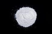 A photograph showing a pile of white zinc powder