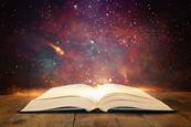 Picture of an open book with glowing, magical dust coming out of it