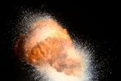 A photograph showing a highly exothermic thermite explosion against a black background