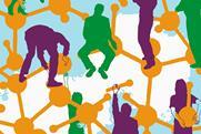 An illustration showing people building molecules