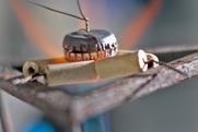 Two bottle tops in a bunsen burner flame