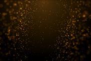 Particulate nature of matter - orange particle graphic on black