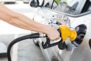 Person putting petrol into a car