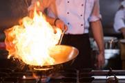 Chef doing flambe on food