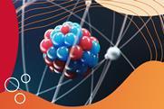 A model of an atom with the nucleus in close up and electron shells surrounding