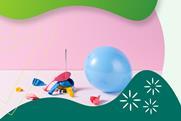 An inflated balloon next to burst balloons