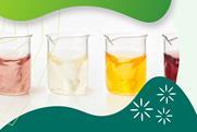 Four beakers with liquid of different colours suggesting different concentrations of solutions
