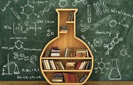 An image of a flask-shaped bookcase in front of a blackboard