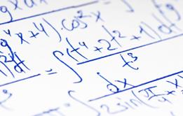 Cartoon of professor with moustache pointing at a blackboard