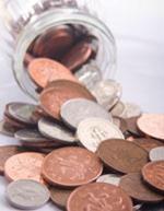 Coins spilling from a jar