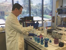 Photo of Michael Wevill, analytical chemist, working with water samples in a lab at Thames Water