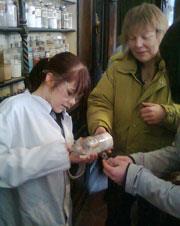 A student reading a bottle label